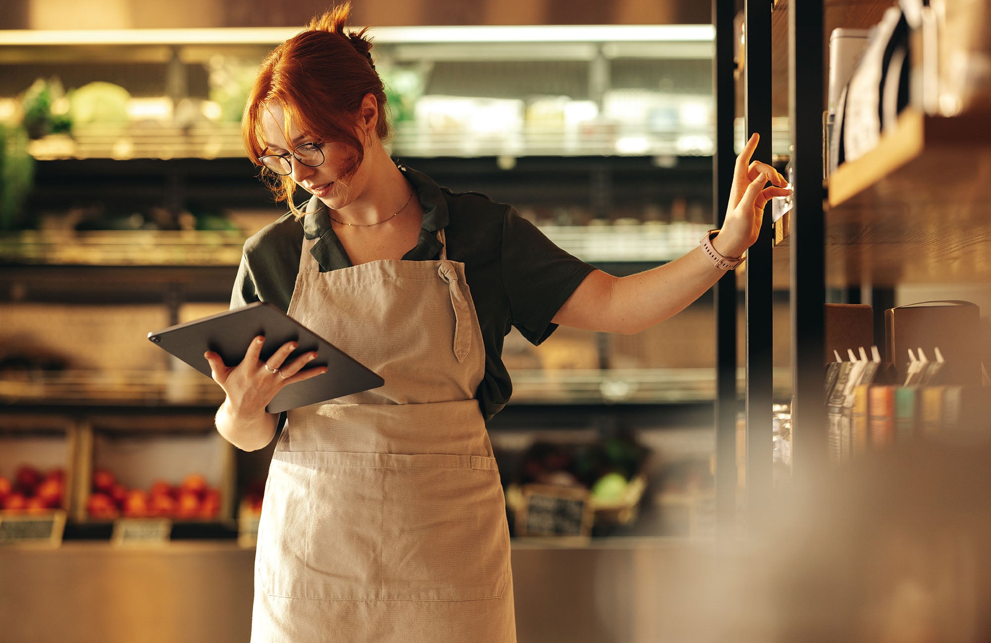 woman holding a refurbished apple ipad while working