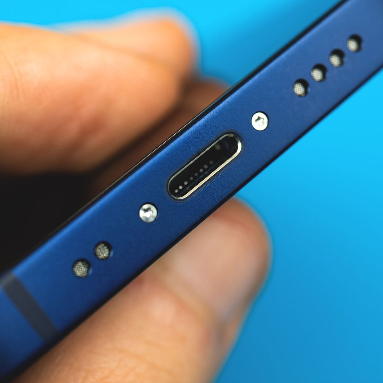 close up of a blue phone charging port